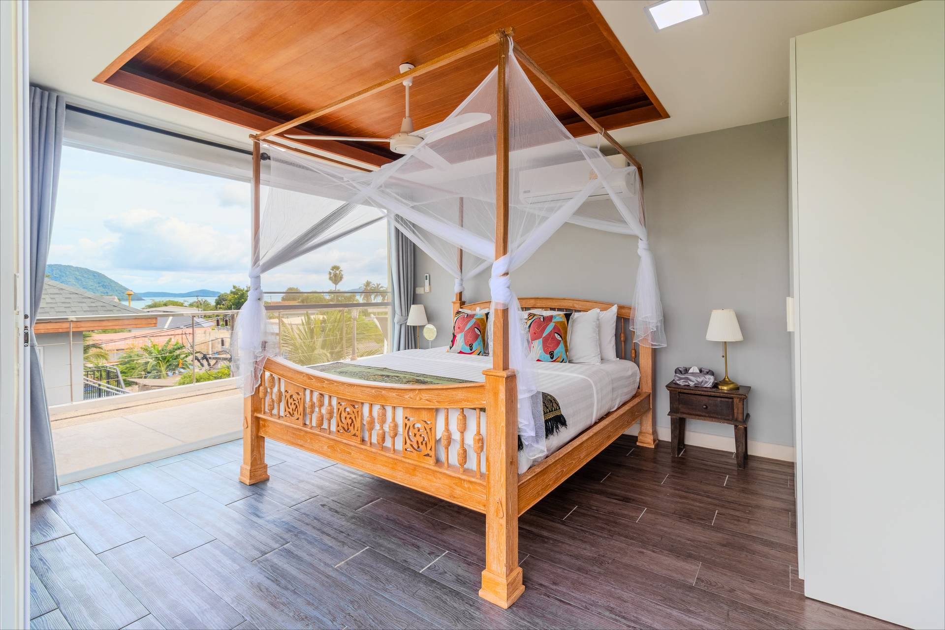Spacious master bedroom suite at Rawai Estate Villa with premium furnishings, king bed, and garden views