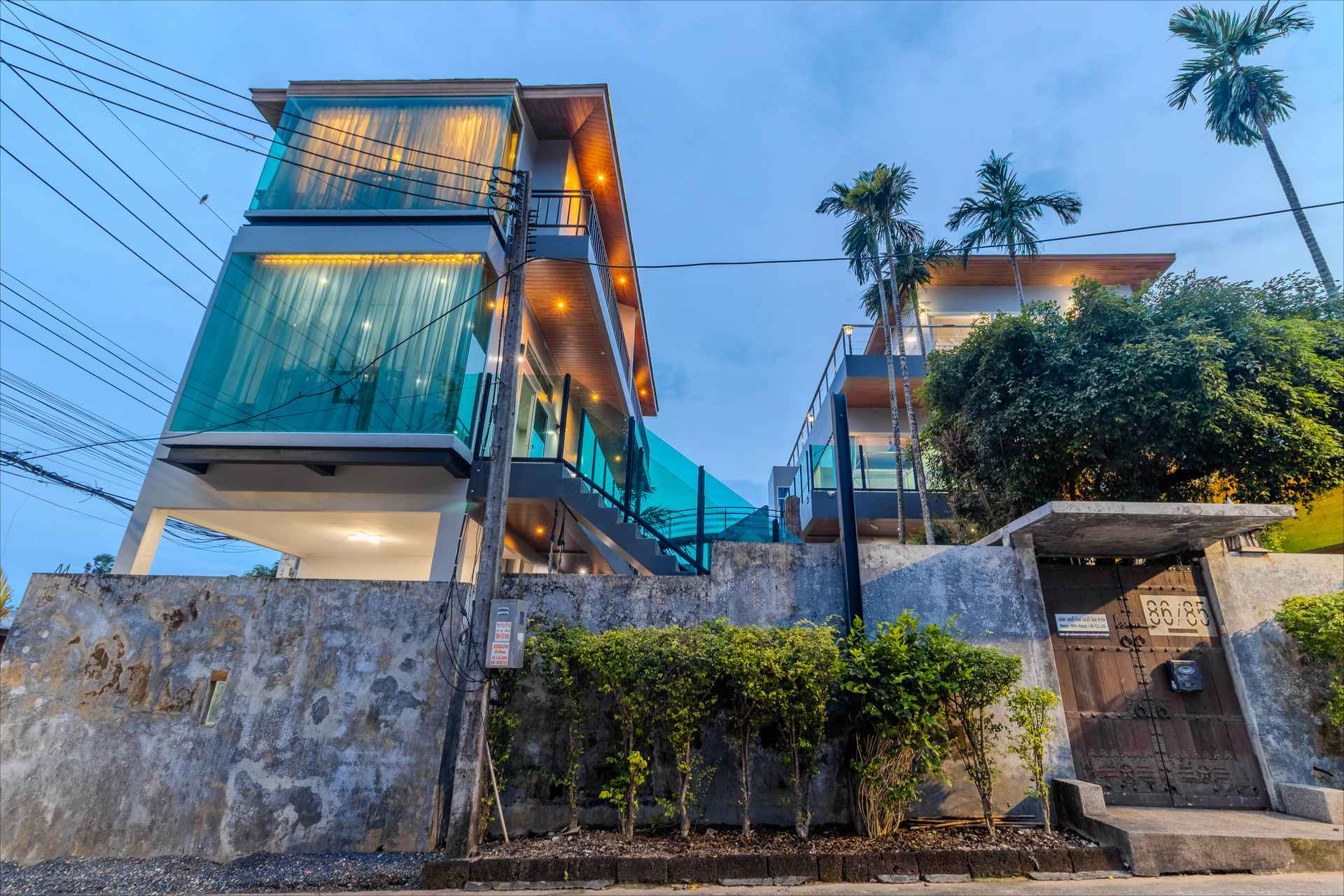 Grand entrance to Rawai Estate Villa with tropical landscaping and dramatic architectural lines