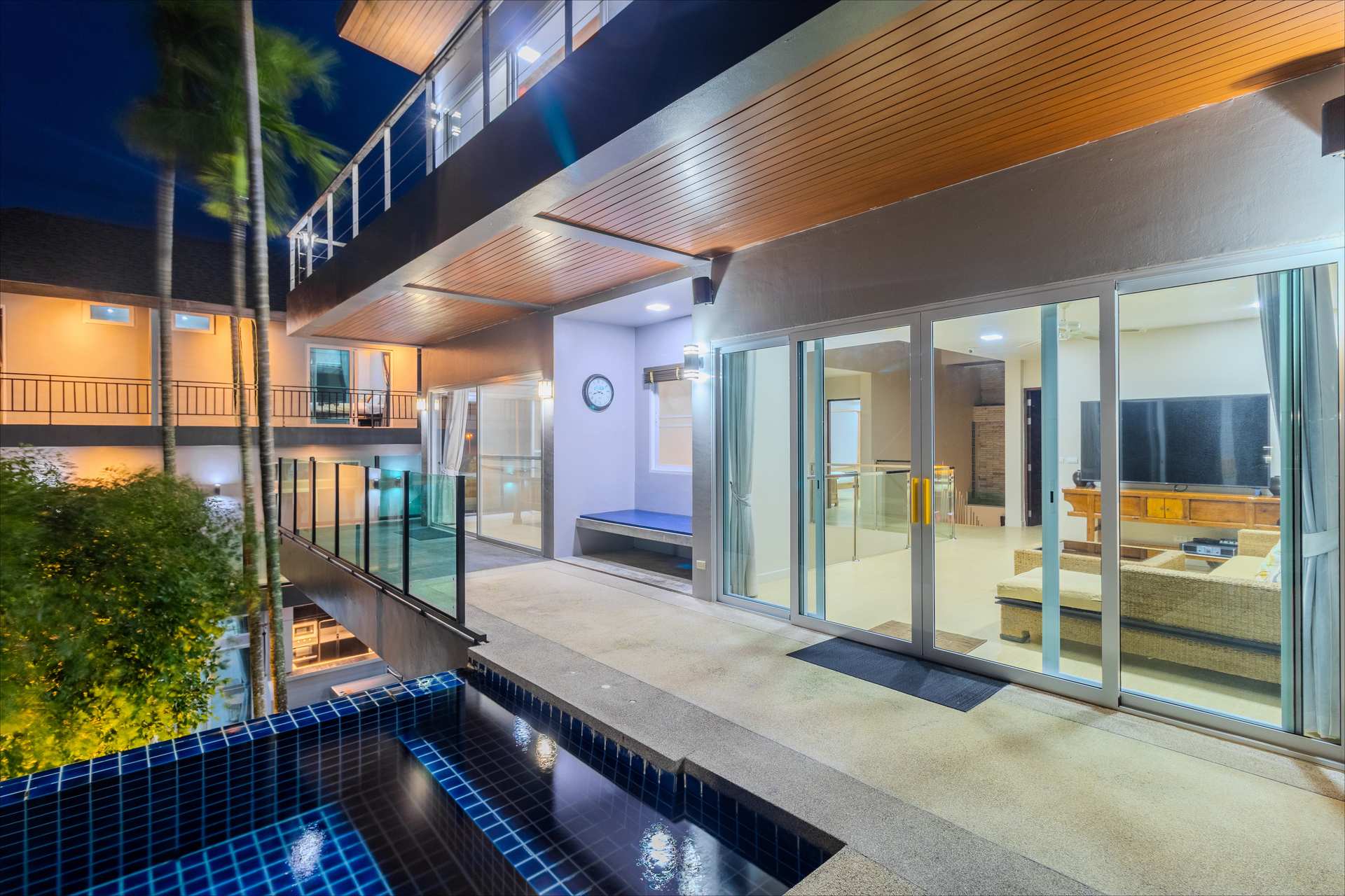 Sophisticated lounge and entertainment space with premium audio visual system and ambient lighting